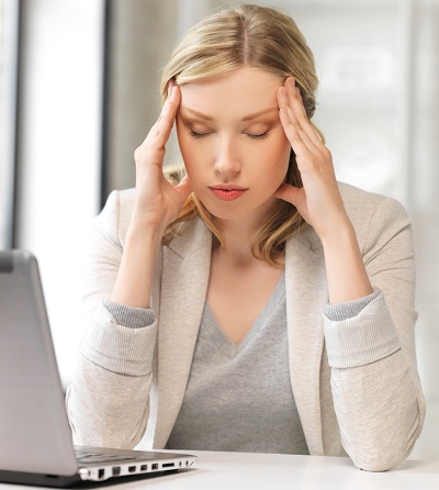 picture of tired woman with laptop computer